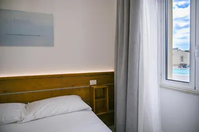 Letto o letti in una camera di Dimora Savarino Marzamemi Suites with pool