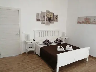 Letto o letti in una camera di Casa Pasubio