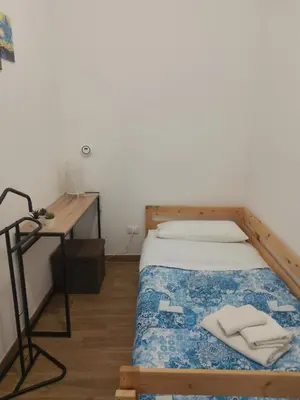 Letto o letti in una camera di Casa Pasubio