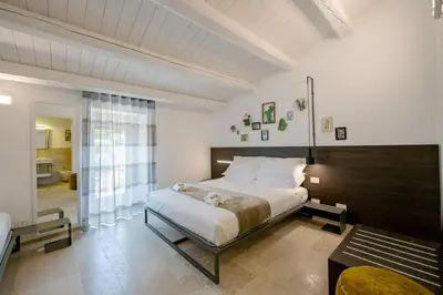 Letto o letti in una camera di IBLA ROOMS