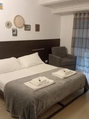 Letto o letti in una camera di IBLA ROOMS