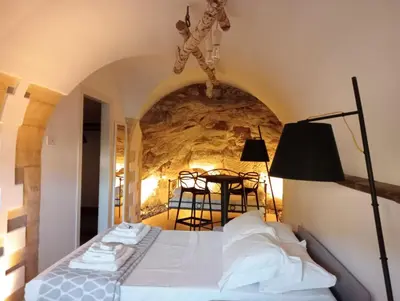 Letto o letti in una camera di IBLA ROOMS