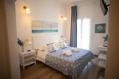Letto o letti in una camera di Azzurro Mare Rooms