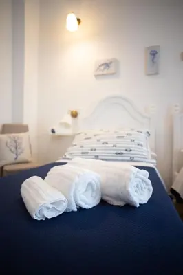 Letto o letti in una camera di Azzurro Mare Rooms