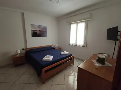 Letto o letti in una camera di LiMonello Marzamemi