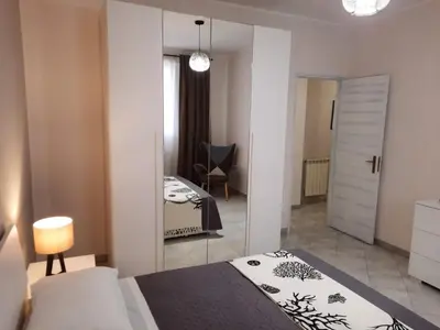 Letto o letti in una camera di Casa vacanze LE PALME NETINE