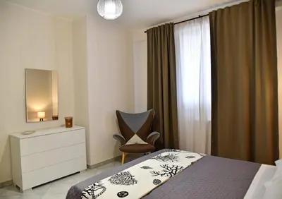 Letto o letti in una camera di Casa vacanze LE PALME NETINE