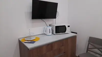 TV o dispositivi per l'intrattenimento presso Ortigia spartan house 3