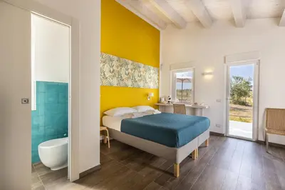 Letto o letti in una camera di I Gelsomini Guest House