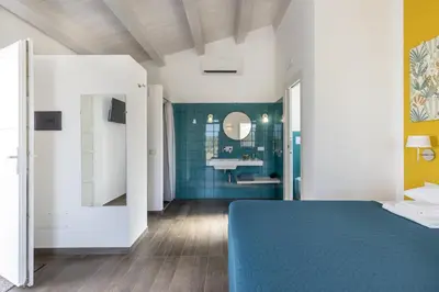 Letto o letti in una camera di I Gelsomini Guest House