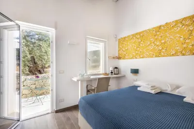 Letto o letti in una camera di I Gelsomini Guest House
