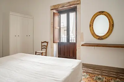 Letto o letti in una camera di La terrazza sul vicolo della Giudecca by Wonderful Italy