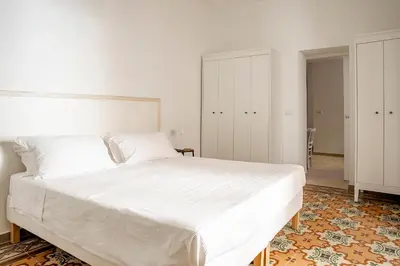 Letto o letti in una camera di La terrazza sul vicolo della Giudecca by Wonderful Italy
