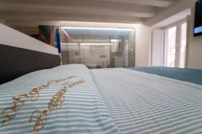 Letto o letti in una camera di Ortigia Charme piazza Duomo