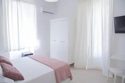 Letto o letti in una camera di Casa Thuja