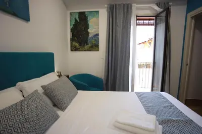 Letto o letti in una camera di B&B Sant'Agata Patrona