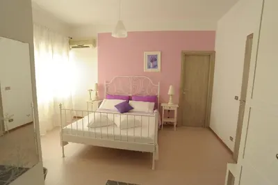 Letto o letti in una camera di B&B Mare di Augusta La Finestra sul Porto