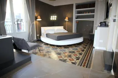 Letto o letti in una camera di Duomo Housing Catania Le Suites