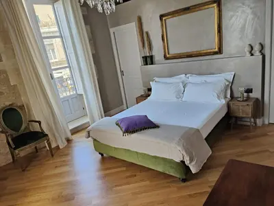 Letto o letti in una camera di Dimora Aretusa Luxury