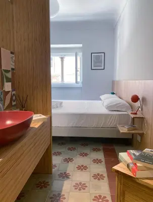 Letto o letti in una camera di Sognalibro Bed and Books