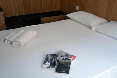 Letto o letti in una camera di Sognalibro Bed and Books