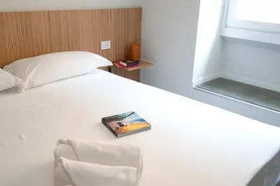 Letto o letti in una camera di Sognalibro Bed and Books
