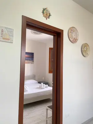 Letto o letti in una camera di Villa Berenice