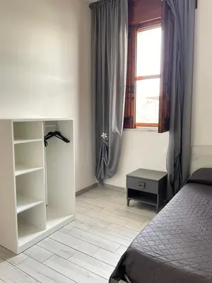 Letto o letti in una camera di Villa Berenice