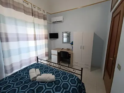 Letto o letti in una camera di Casa Emanuele