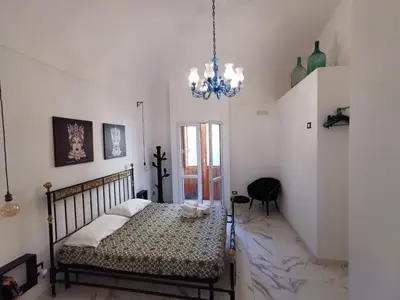 Letto o letti in una camera di Casa Annita, casa vacanza in stile Sicilia, in pieno centro a Pachino