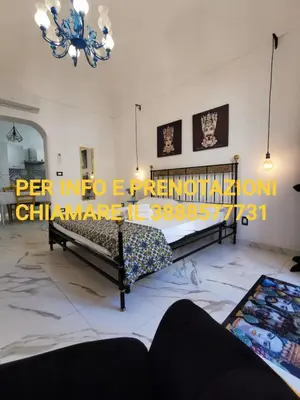 Letto o letti in una camera di Casa Annita, casa vacanza in stile Sicilia, in pieno centro a Pachino