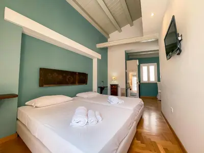 Letto o letti in una camera di La Casetta di Ro Ortigia