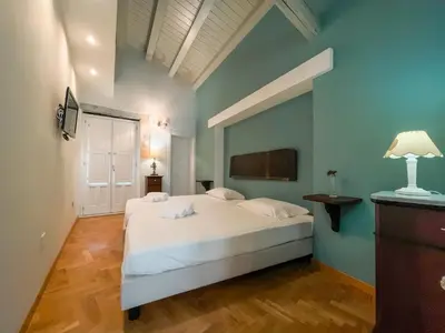 Letto o letti in una camera di La Casetta di Ro Ortigia