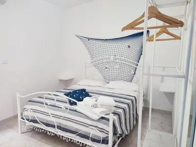 Letto o letti in una camera di Al Meriggio Apartments