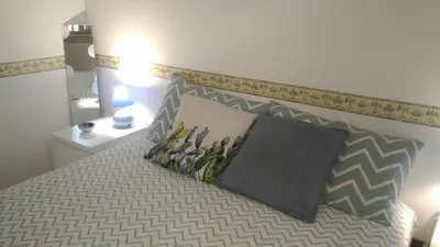 Letto o letti in una camera di Villino Oleandro