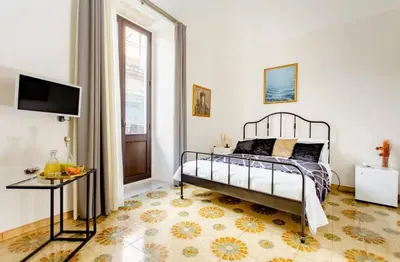 Letto o letti in una camera di 4Tino