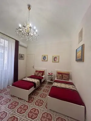 Letto o letti in una camera di 4Tino