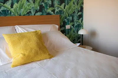 Letto o letti in una camera di ALTAMOTHYCA