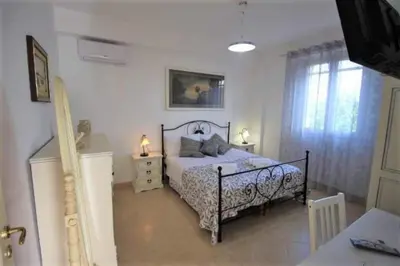 Letto o letti in una camera di Bilocale climatizzato - Wi-fi in villa in pieno relax