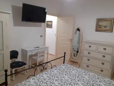 Letto o letti in una camera di Bilocale climatizzato - Wi-fi in villa in pieno relax