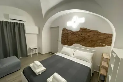 Letto o letti in una camera di Catania Dammuso house