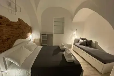 Letto o letti in una camera di Catania Dammuso house