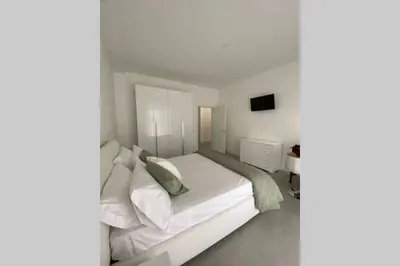 Letto o letti in una camera di Ambra del Simeto Appartamento moderno vicino il Teatro Greco