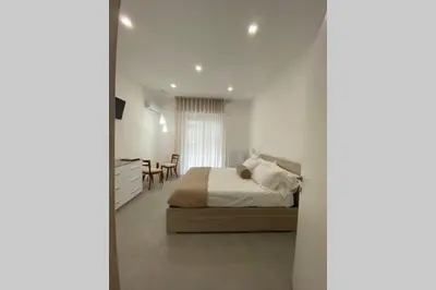 Letto o letti in una camera di Ambra del Simeto Appartamento moderno vicino il Teatro Greco