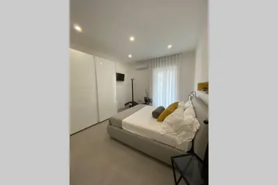 Letto o letti in una camera di Ambra del Simeto Appartamento moderno vicino il Teatro Greco