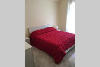 Letto o letti in una camera di Casa Helios con ascensore
