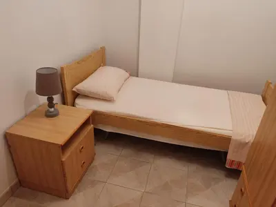 Letto o letti in una camera di Casa Helios con ascensore