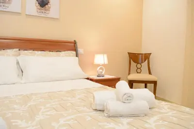 Letto o letti in una camera di Home Paola