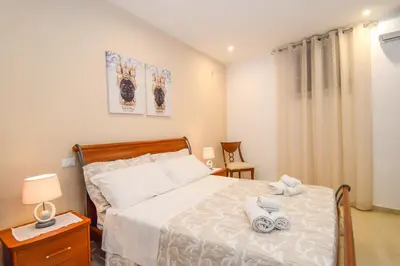 Letto o letti in una camera di Home Paola