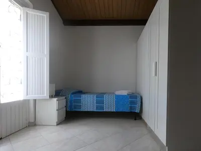 Letto o letti in una camera di Casa Nicea